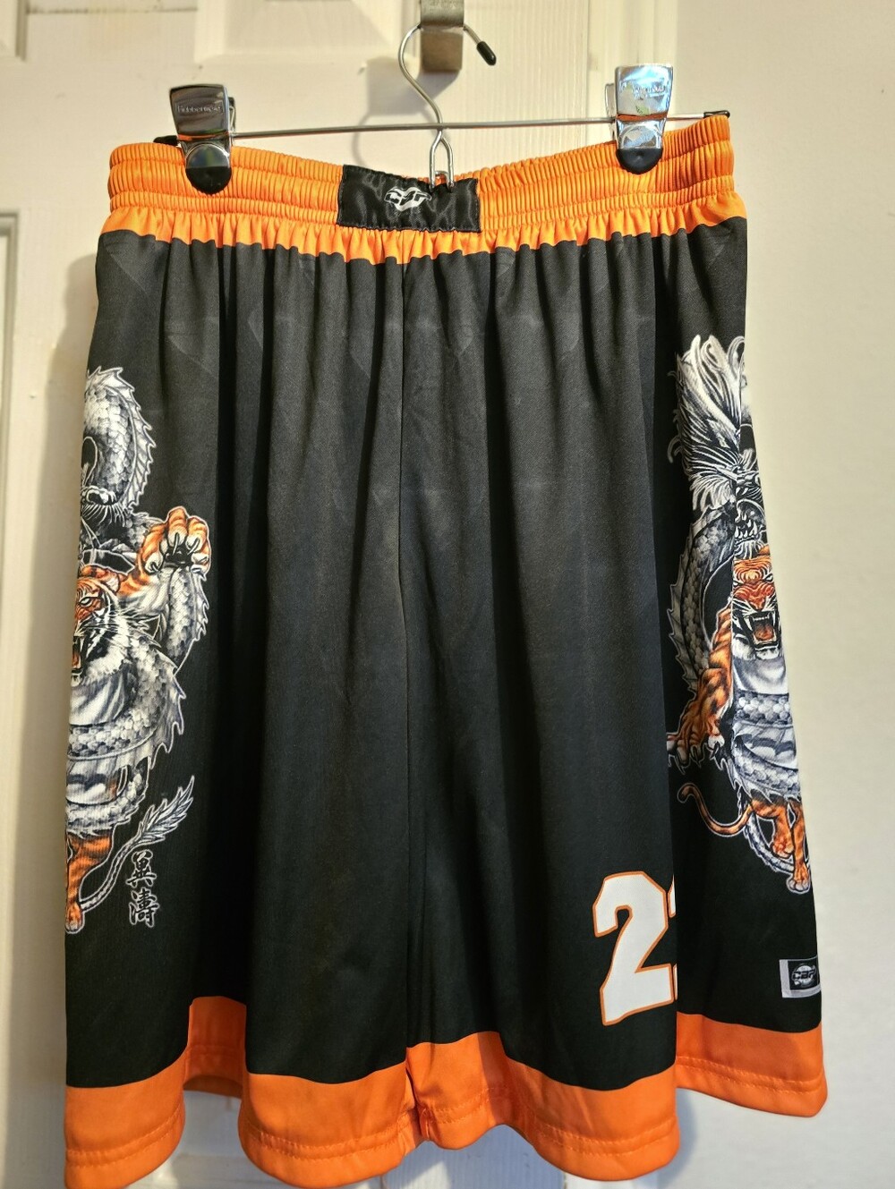 bp Black Tee with Orange Hem and White Logo